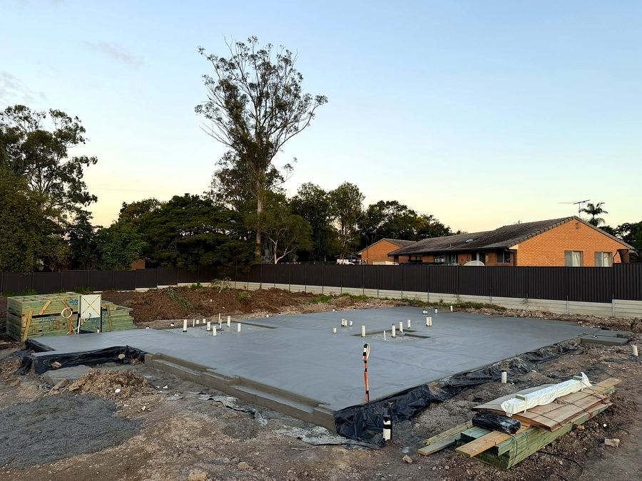 The same slab from the street side, edge beams and penetrations set