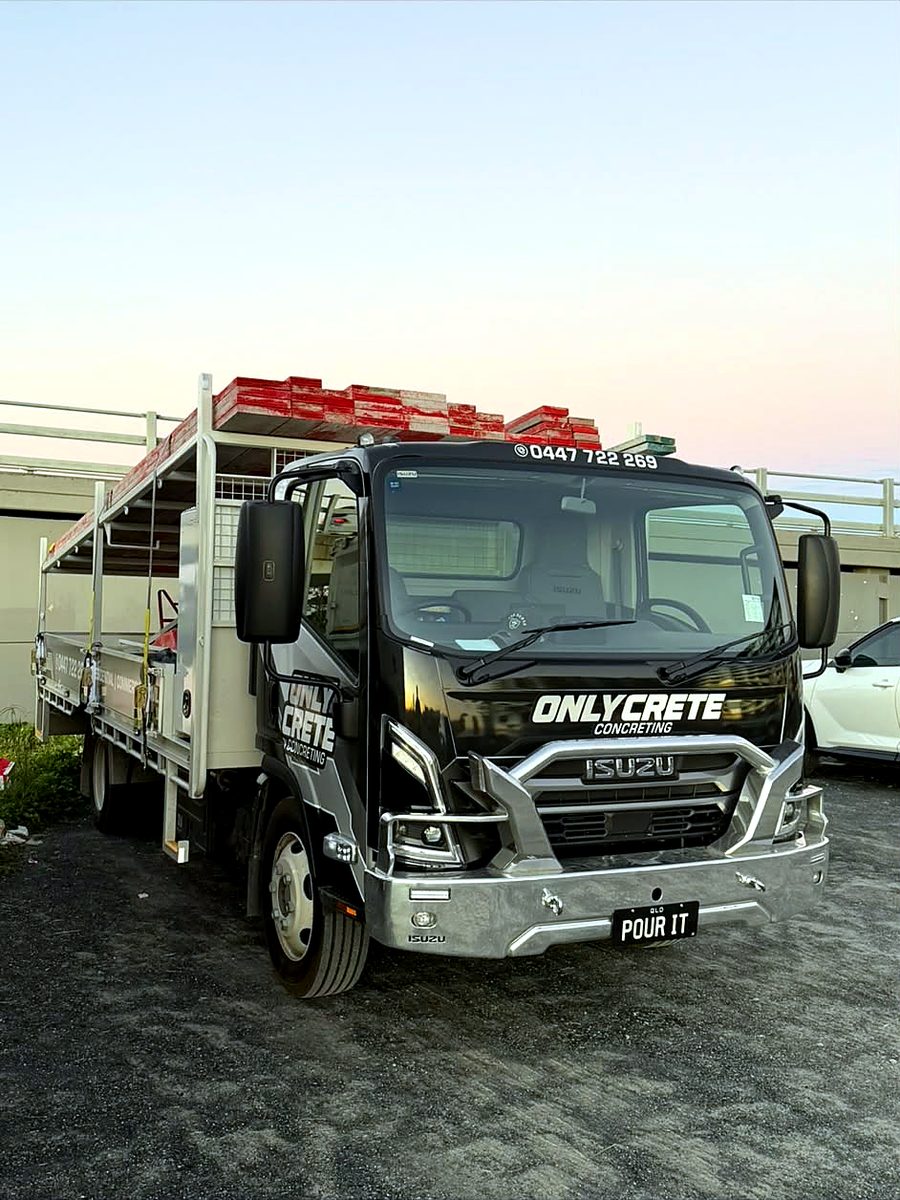 The OnlyCrete Concreting Isuzu truck, number plate POUR IT